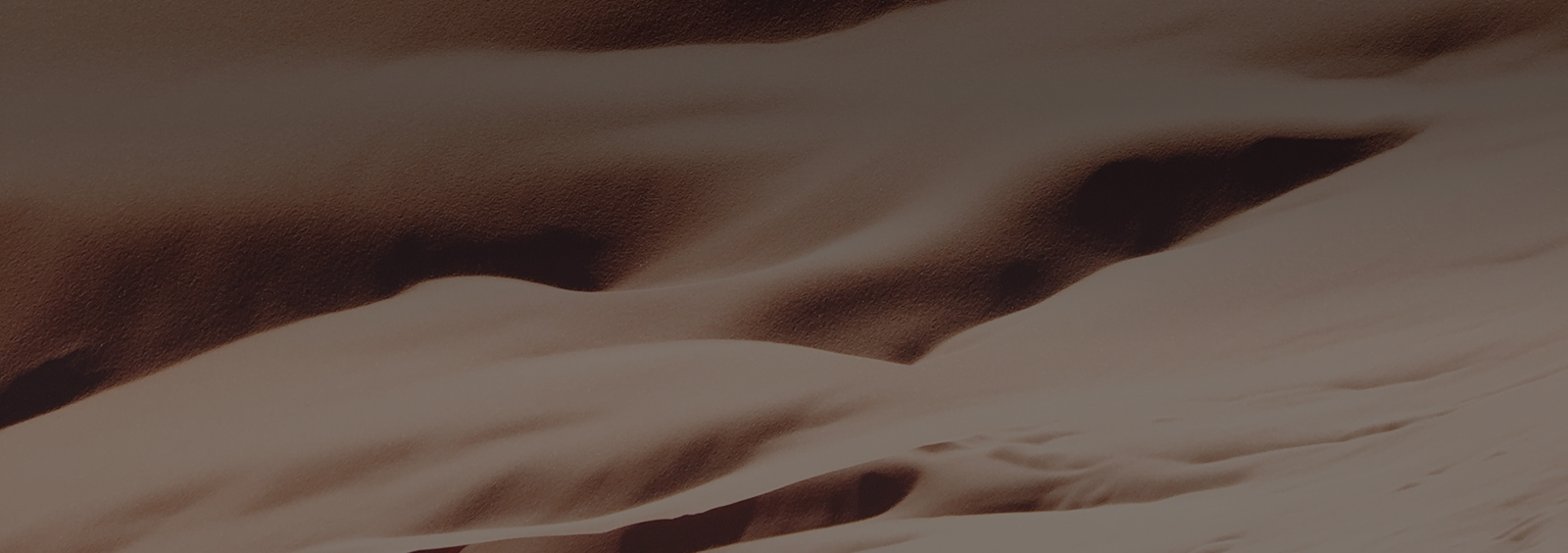 Abstract sand dunes in warm tones.