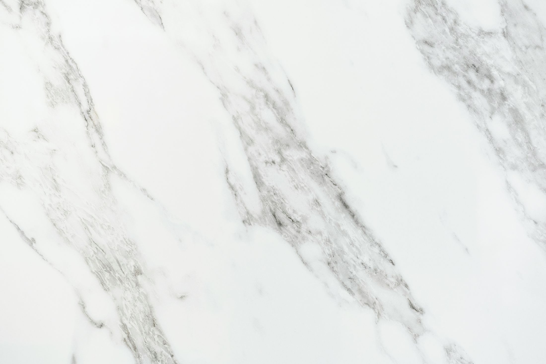 White marble surface with gray veining pattern.
