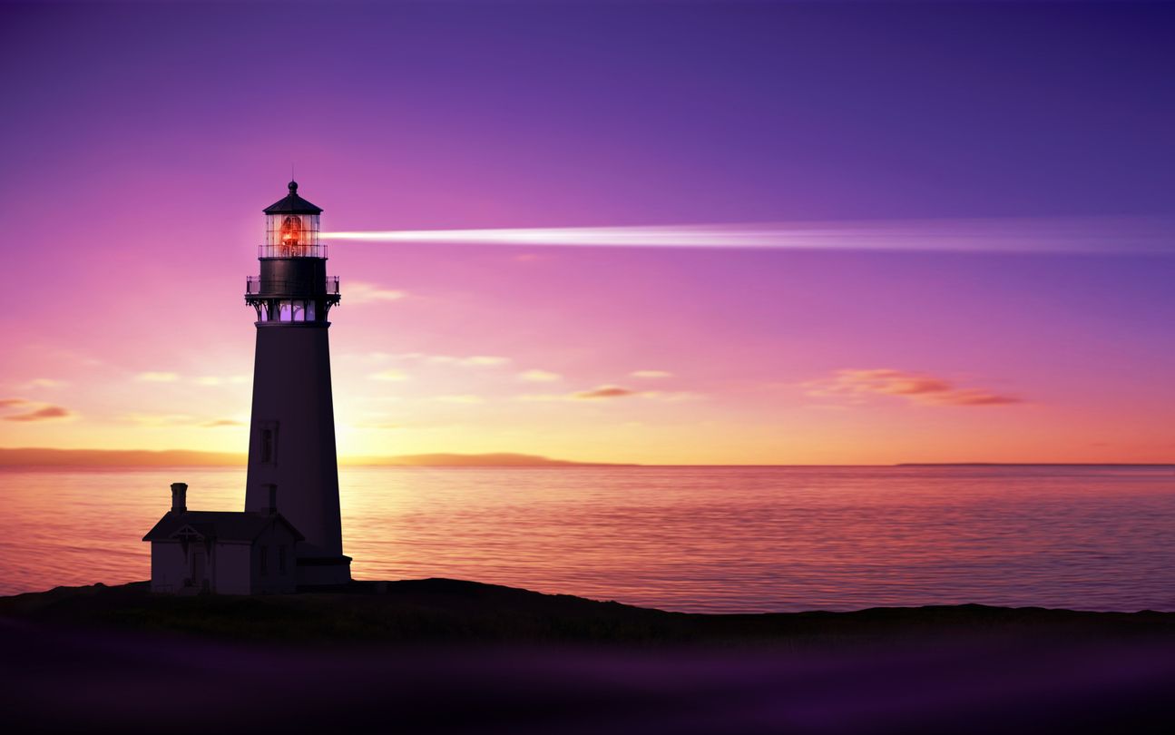 Lighthouse at sunset with vibrant colors.