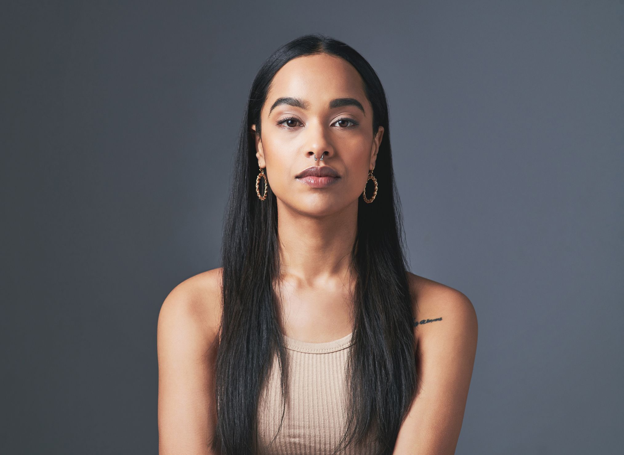 Portrait of a woman with long dark hair.